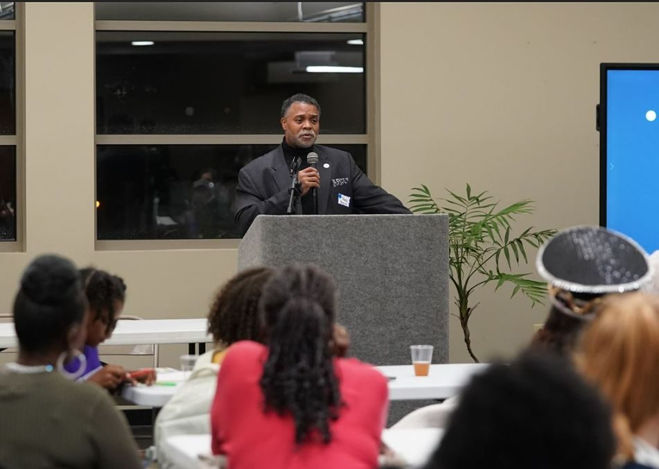A community leader speaking to an audience
